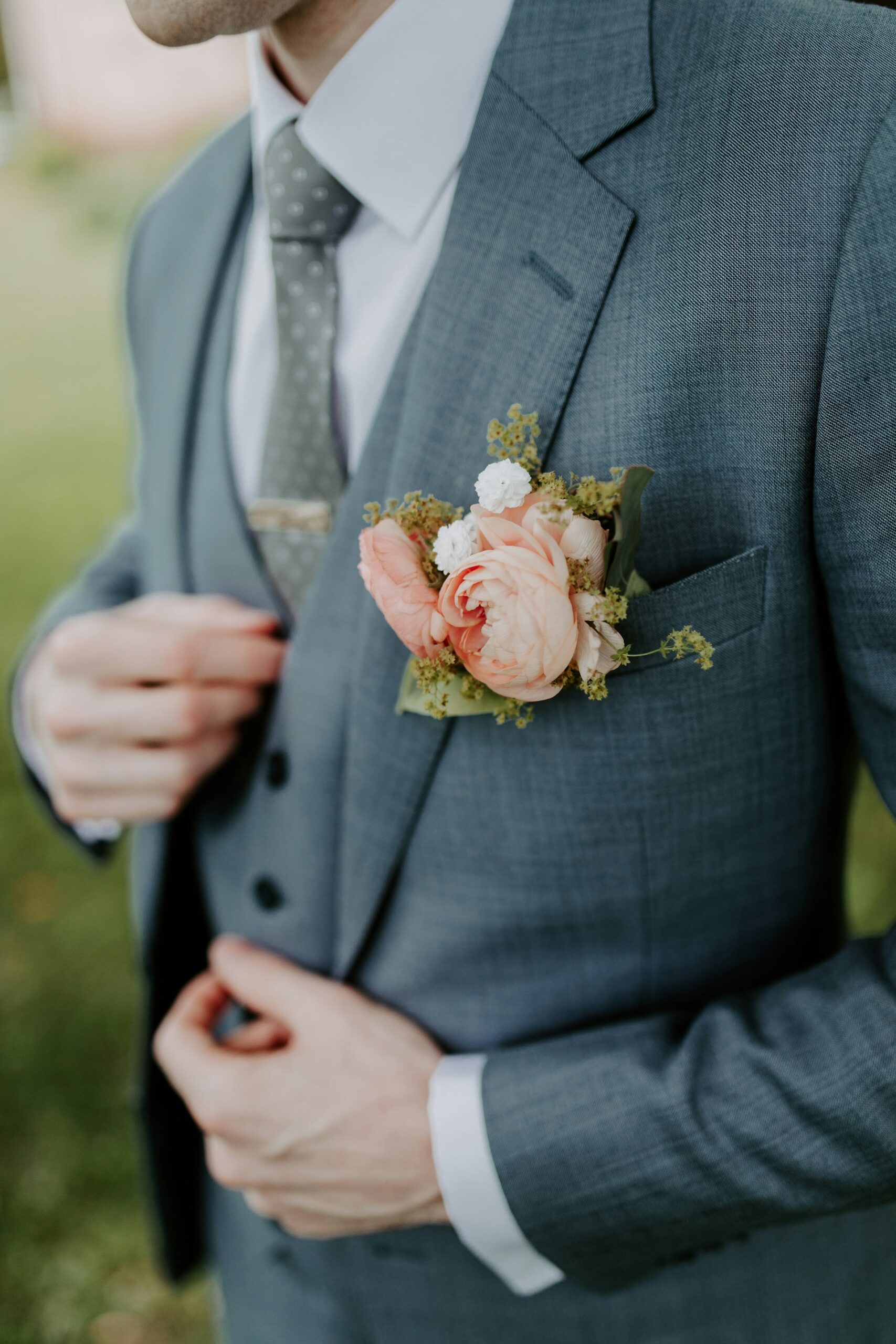 Wedding groom with bouquet